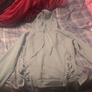 Gray hoodie with criss-cross ties on the sides
